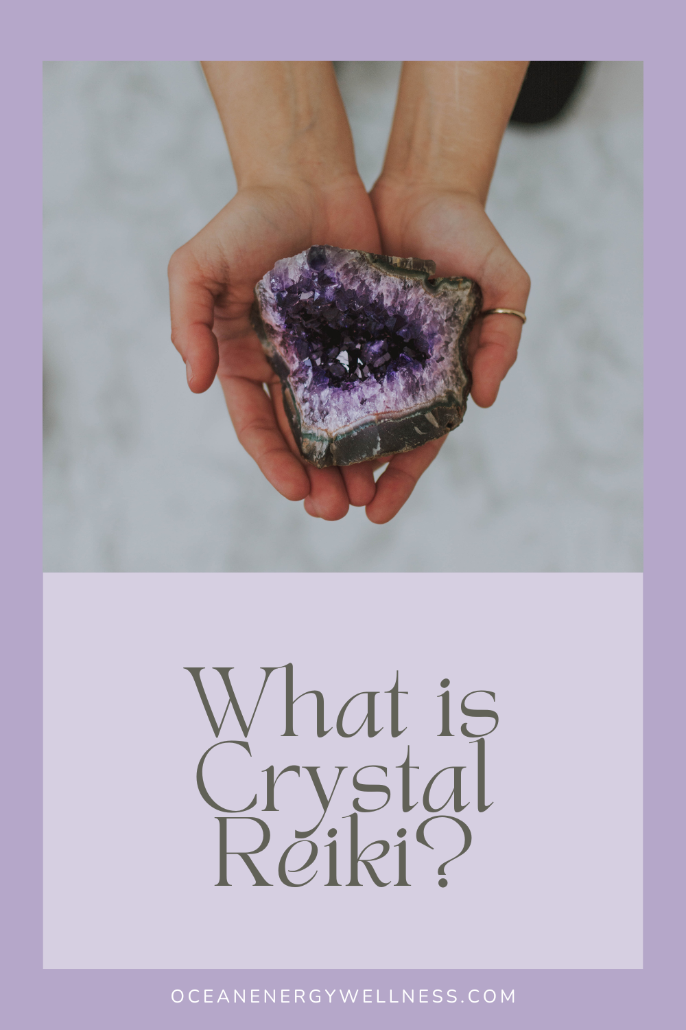 hands holding amethyst crystal and connecting with crystal reiki
