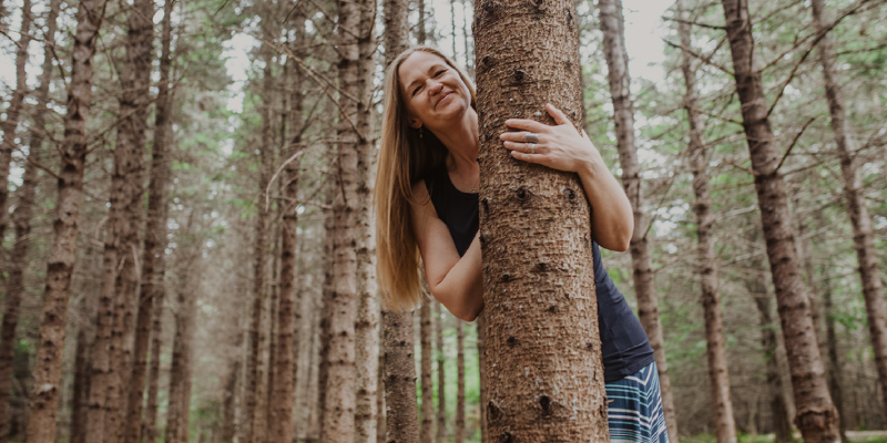 Brenda hugging a tree