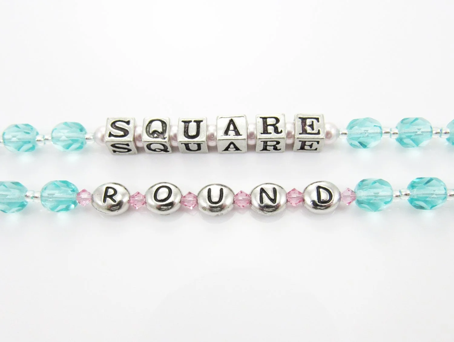 Beaded jewelry string with beads spelling 'SQUARE' and 'ROUND' on a white background.