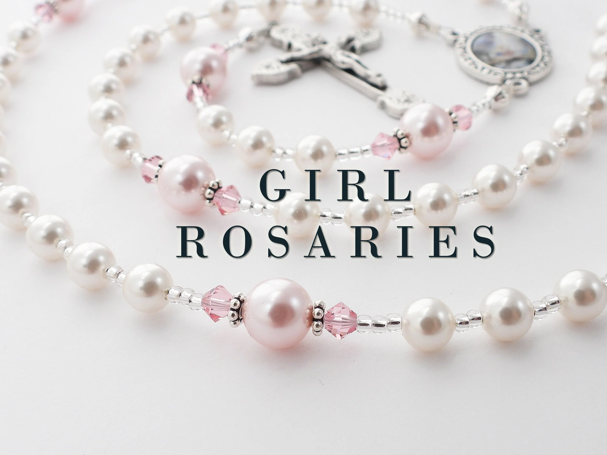 A close-up of pearl and pink bead necklaces with silver accents, with the text 'GIRL POSARIES' overlaid on the image.
