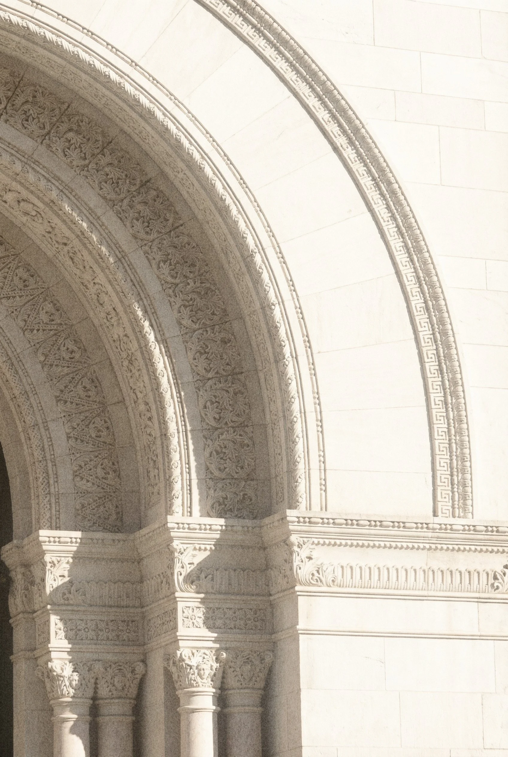 Ornate architectural columns — visual inspiration behind the refined aesthetic at By Modern Muse design studio