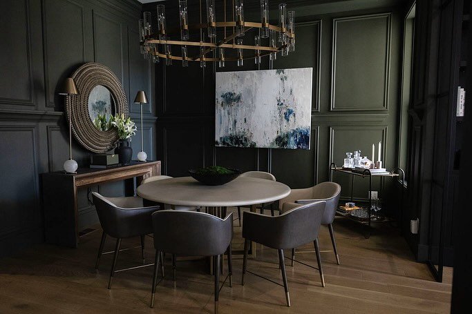 From rendering, to completion ✨ We wanted this Dining Room to feel formal yet approachable, so we mixed in some gorgeous textures (wood, palm leaf mirror &amp; leather) to soften the more traditionally formal elements (the chandelier, table lamps &am