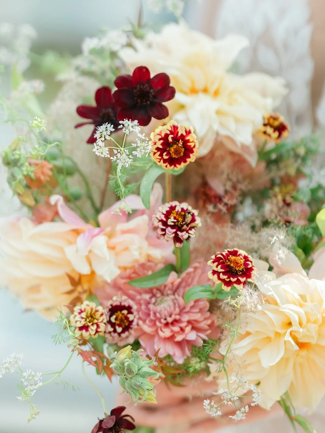 The way the chocolate cosmos and the cilantro flower dance above the Persian carpet zinnia and creamy cafe au lait dahlias really makes me siiiiiigh. 

Concept/Photographer: @kameevaldezphoto
Florist: @imogenfloral
Wedding Gown: @aw.bridal
Veil: @ale