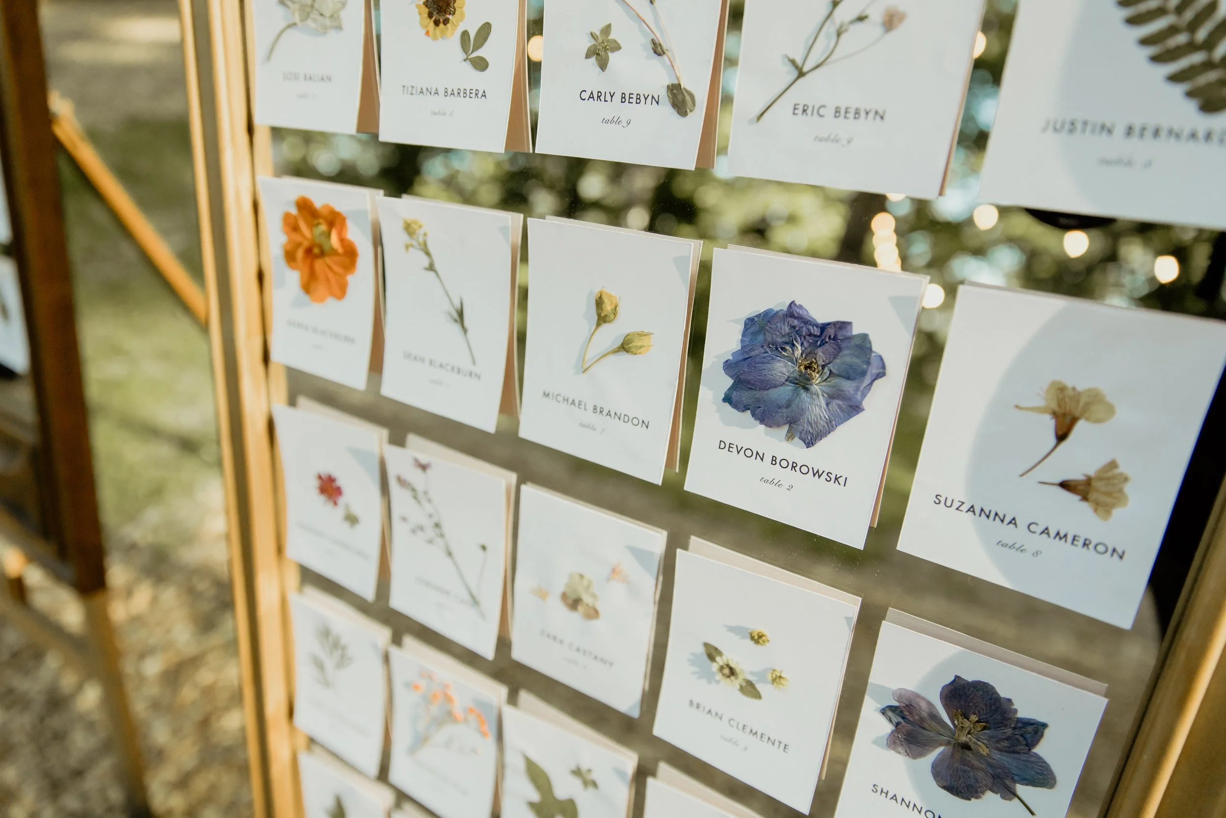 Pressed flower escort cards wedding