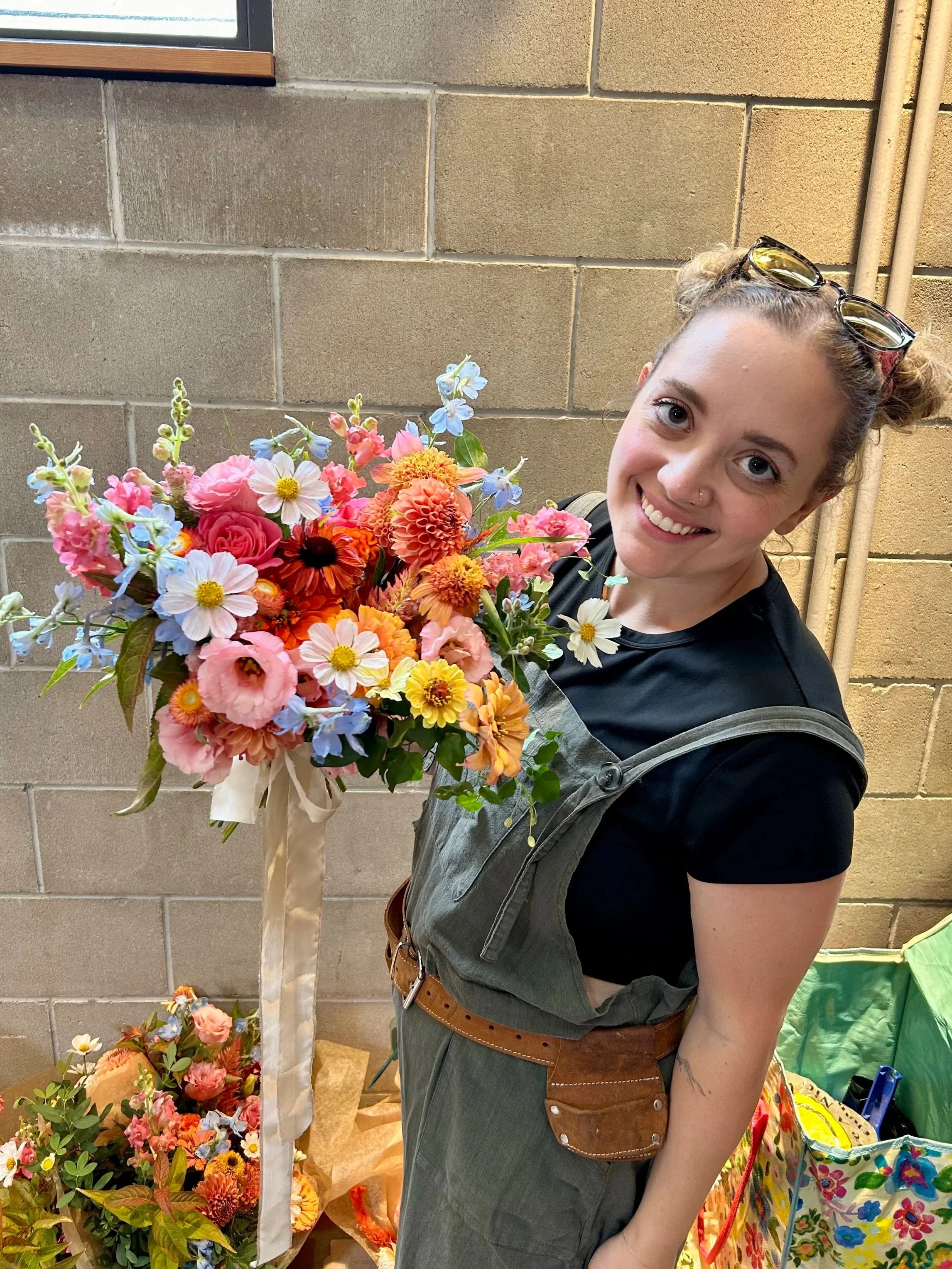 Julia holding a summer wildflower bridal bouquet