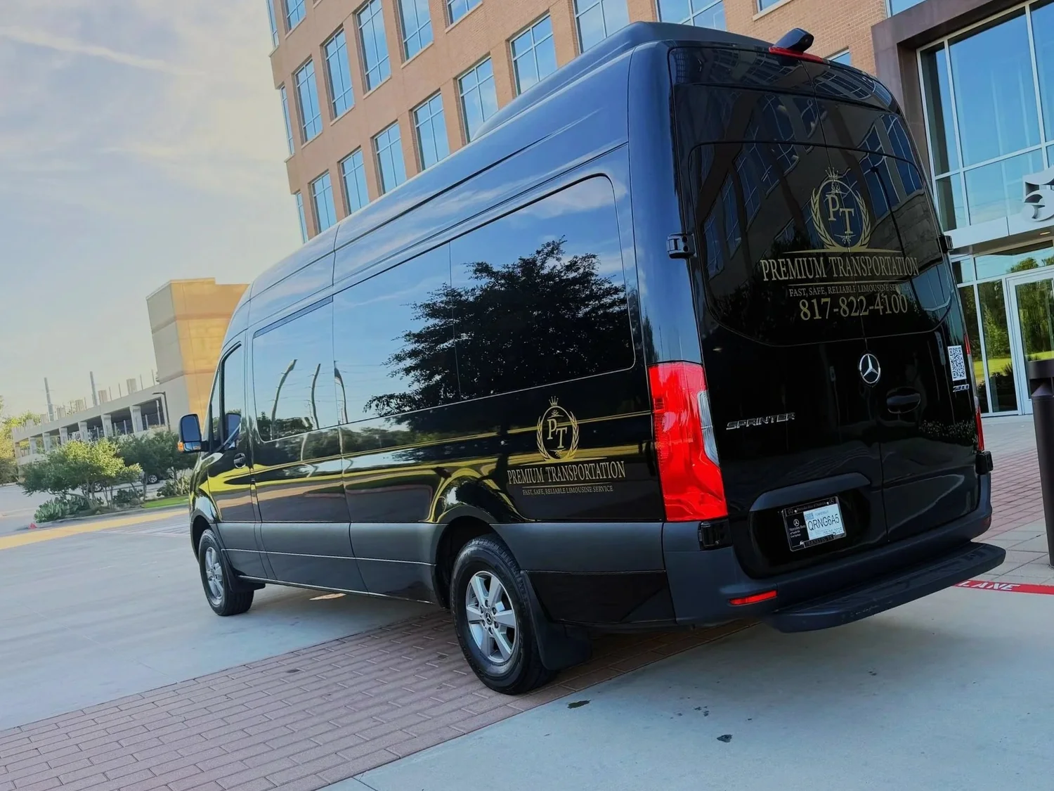 Premium Transportation Mercedes-Benz Sprinter outside a modern office building