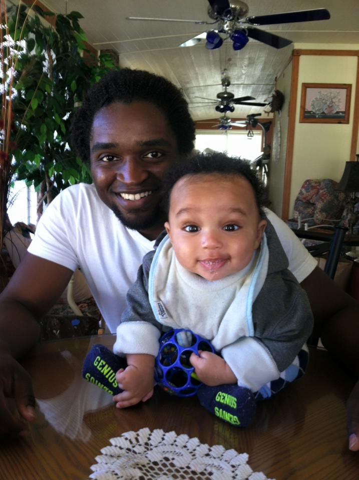 Elwyn Alexander Fraser Junior with 1st child at Elwyn's parents' home