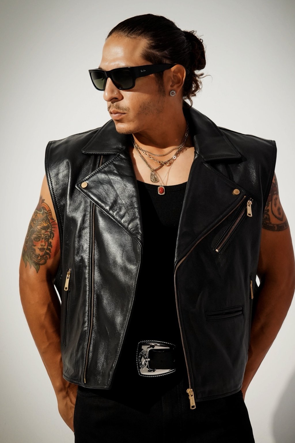 Tommy Francisco wearing a black leather vest and sunglasses