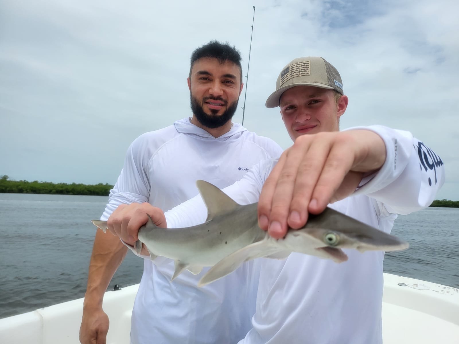 2 people with shark.jpg