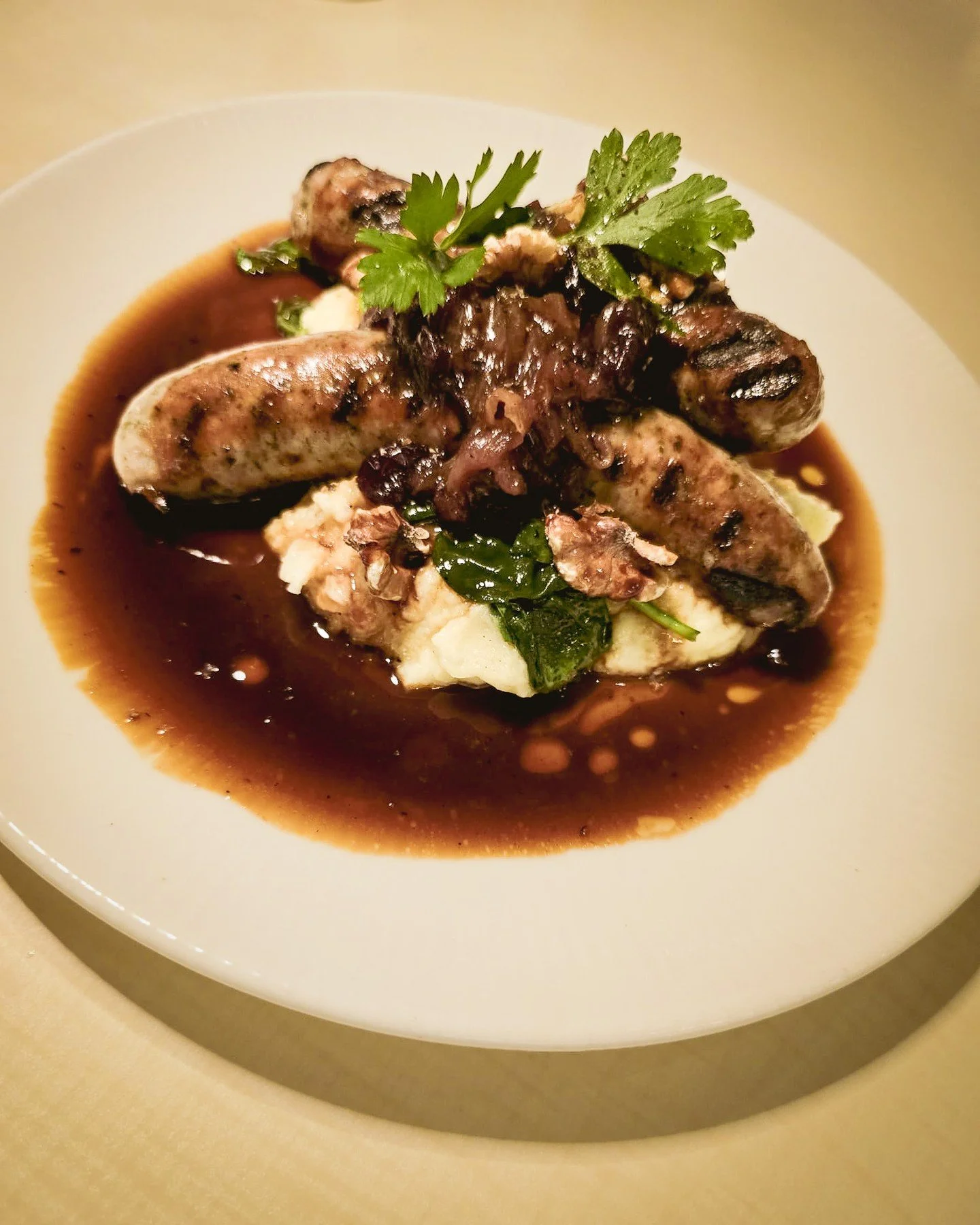 Our Bistro Bangers &amp; Mash &ndash; sage &amp; rosemary pork sausage, potato mash, wilted spinach, walnuts, onion &amp; apple pie relish.⁠
⁠
#chipbeebistro #cbb #hnhg