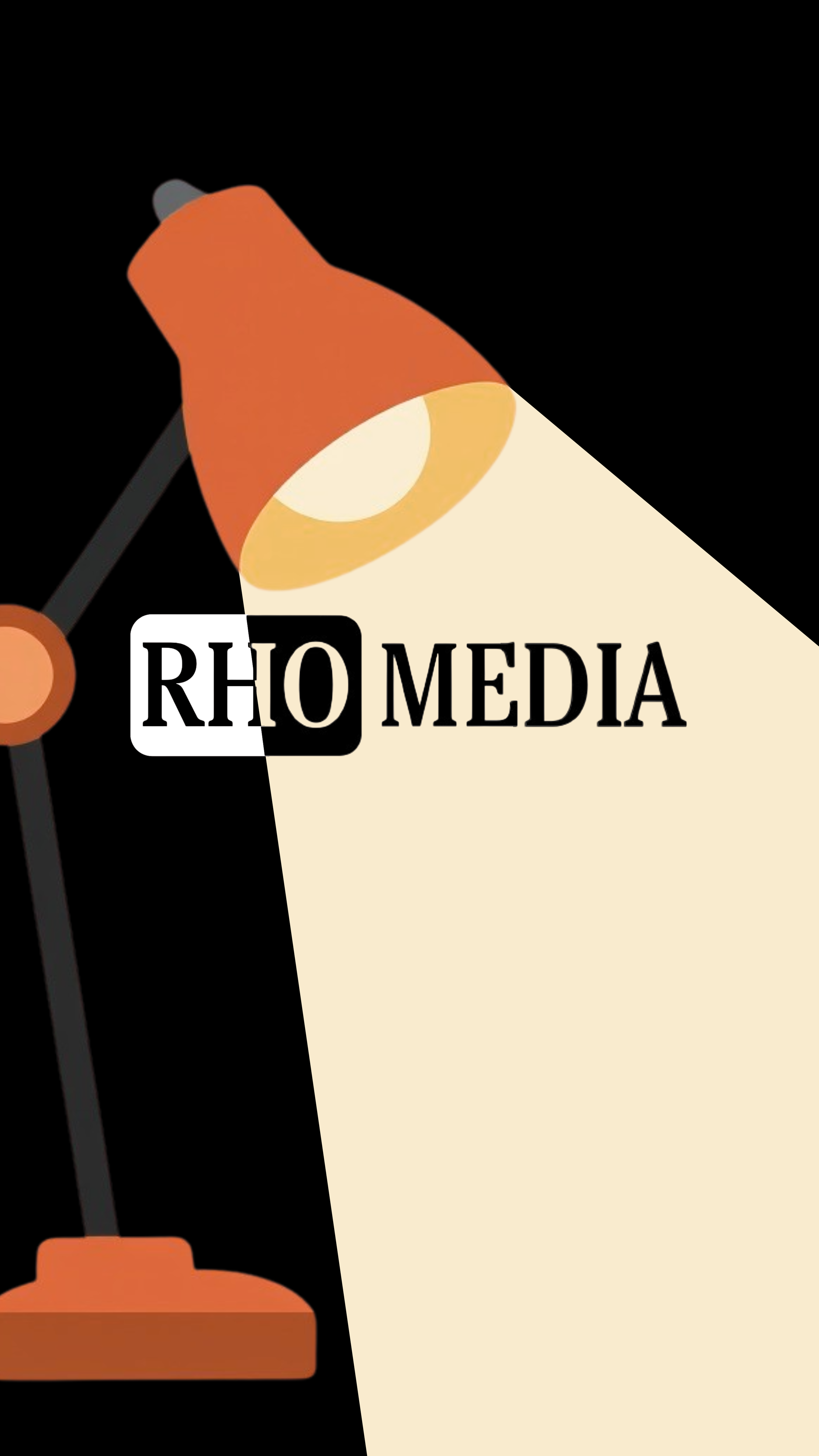 An illustration featuring a table lamp casting a warm light onto a piece of paper or document with the handwritten or printed words 'RHO MEDIA'. The background is black, emphasizing the lamp and the text.