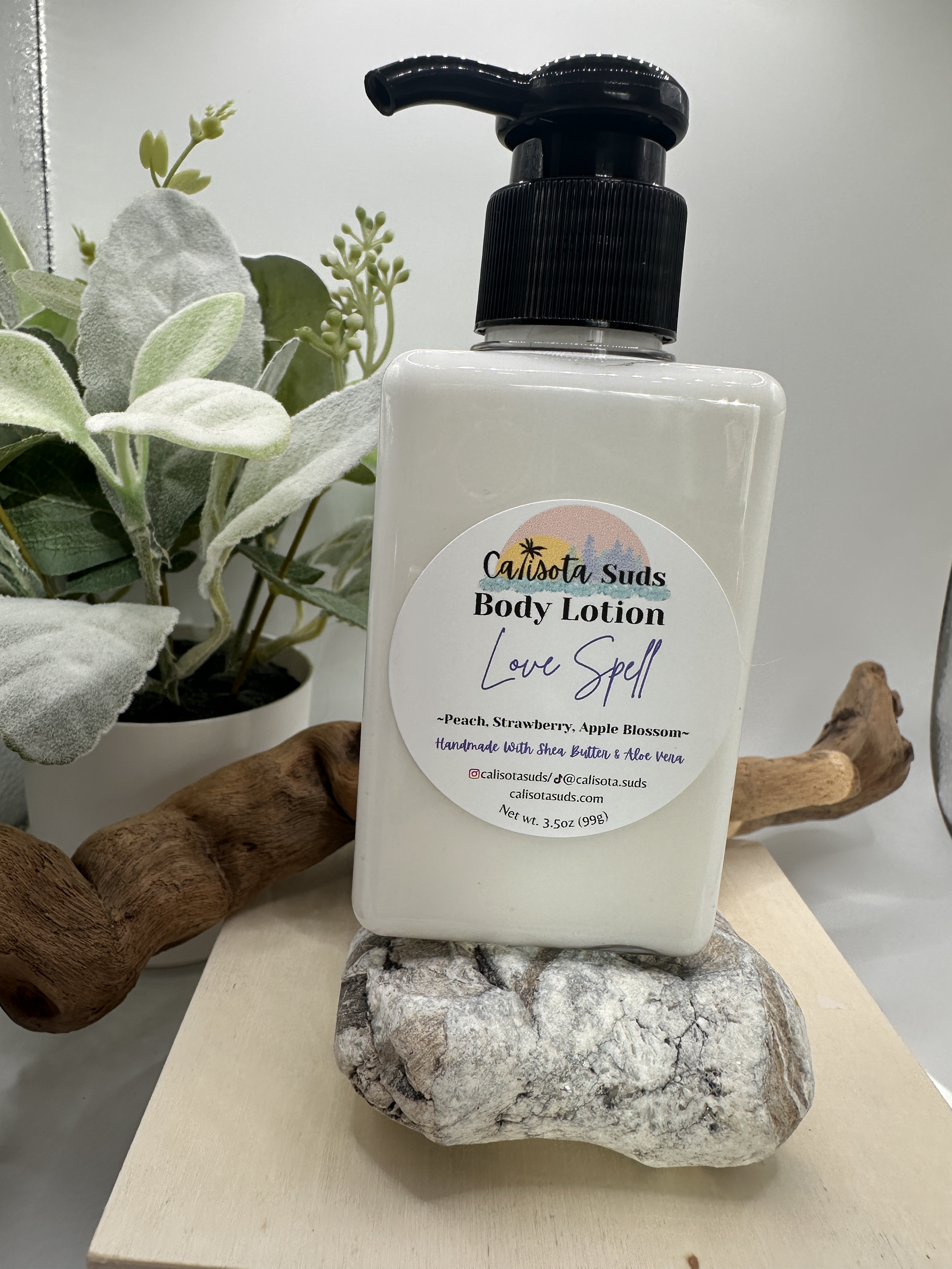 Body Lotion Love Spell wht tile and wood bin Bg.png
