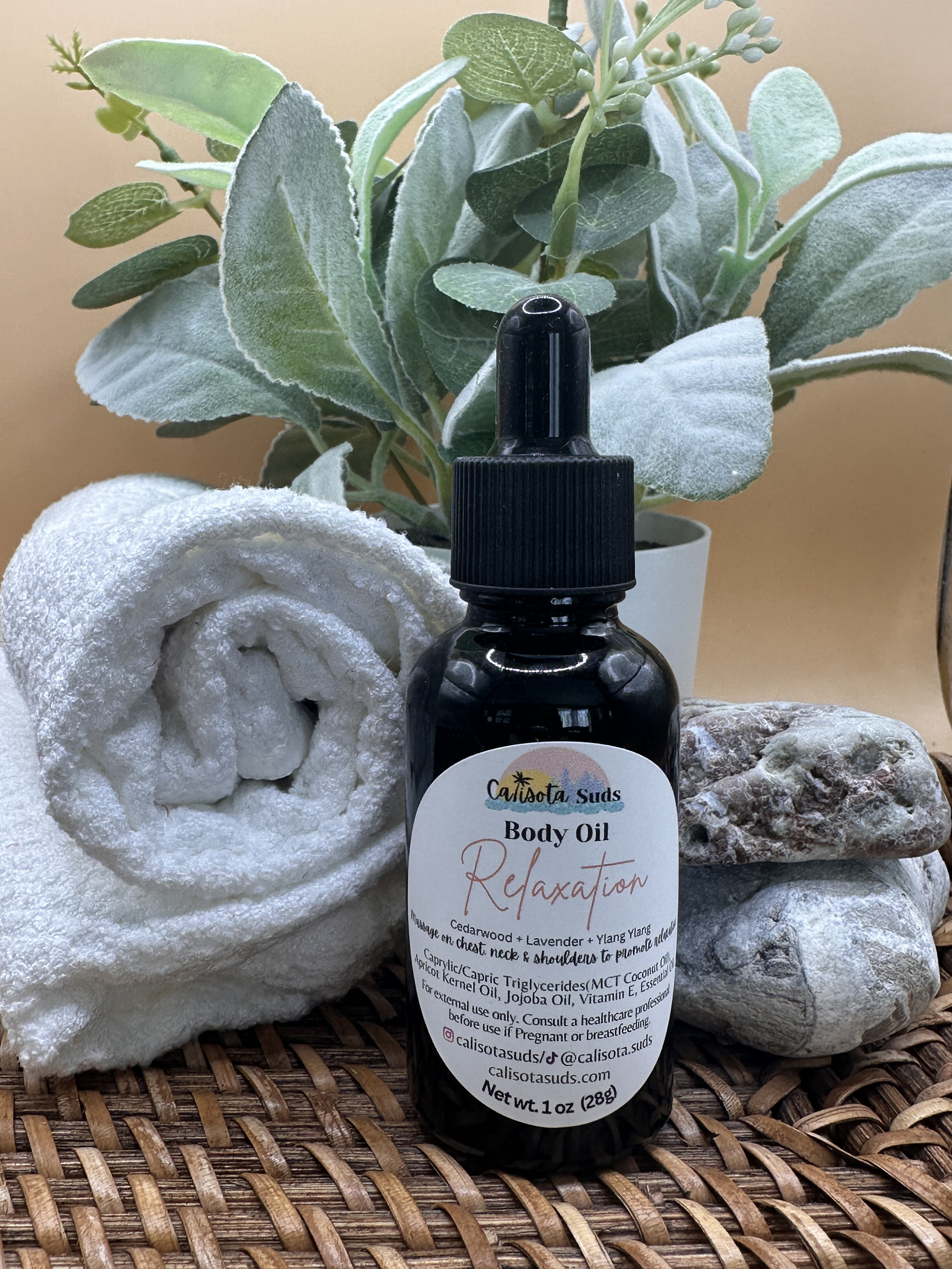 Body Oil Relaxation basket towel bg.png