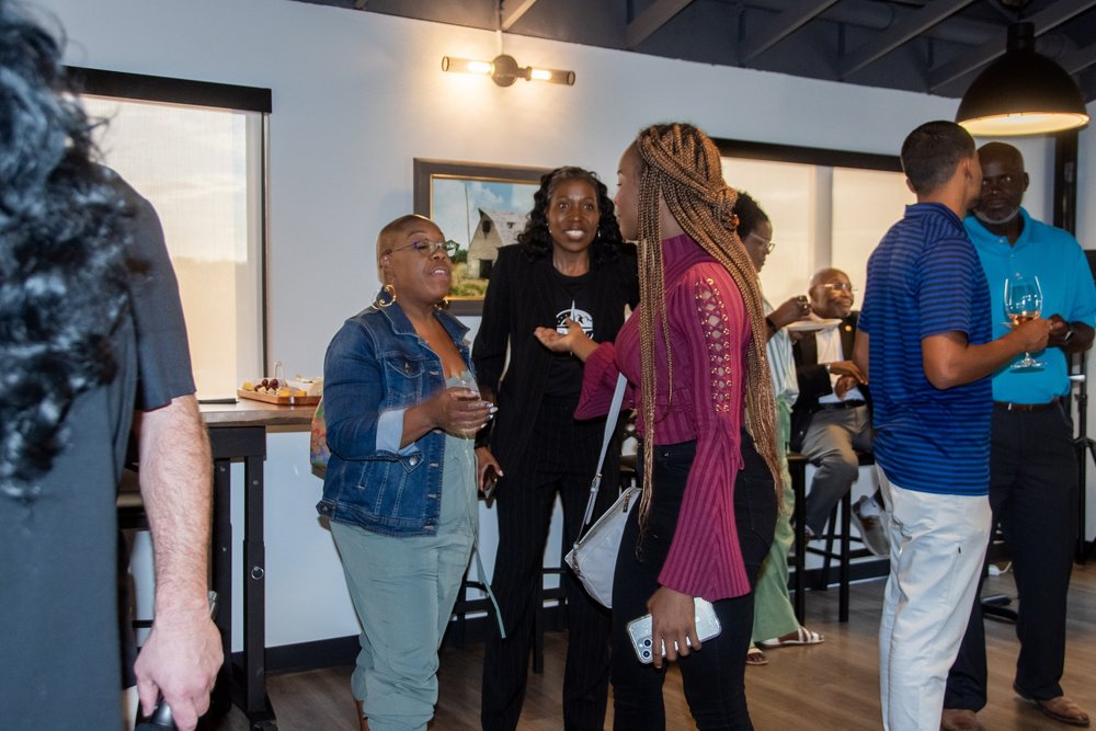 Guests in conversation at a First Fridays Boise networking gathering