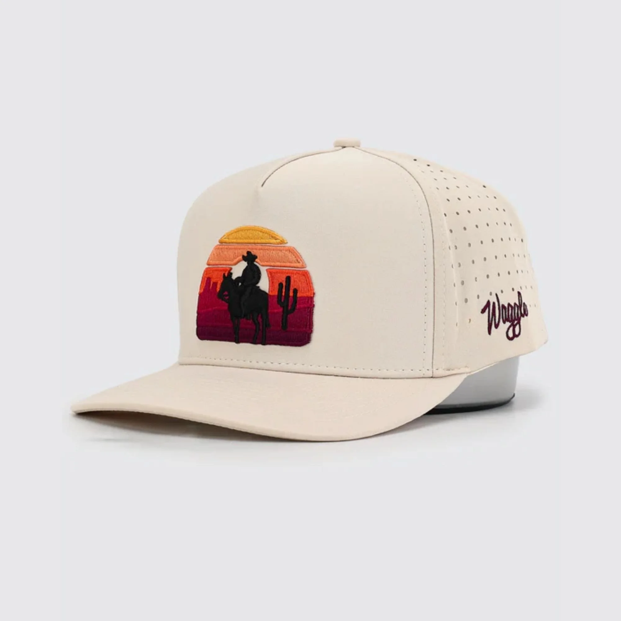 Waggle OB Outlaw hat, tan, angled front view showing cowboy and desert sunset embroidery detail