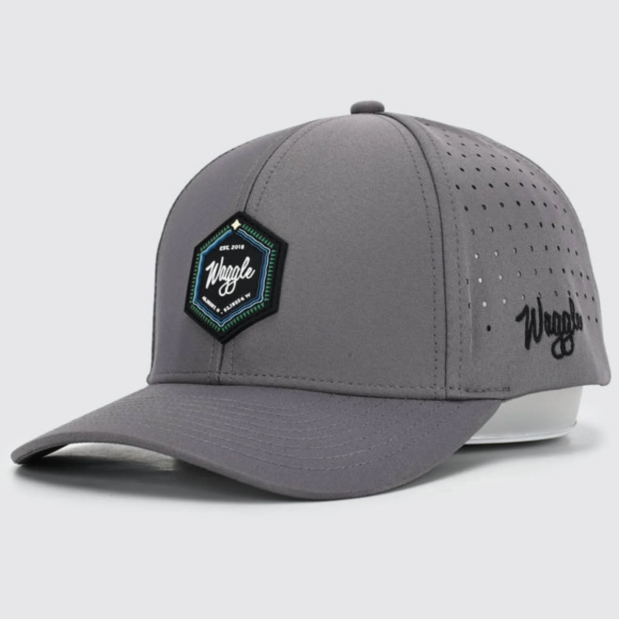 Waggle Origin hat, angled front view showing hexagon patch and Waggle logo