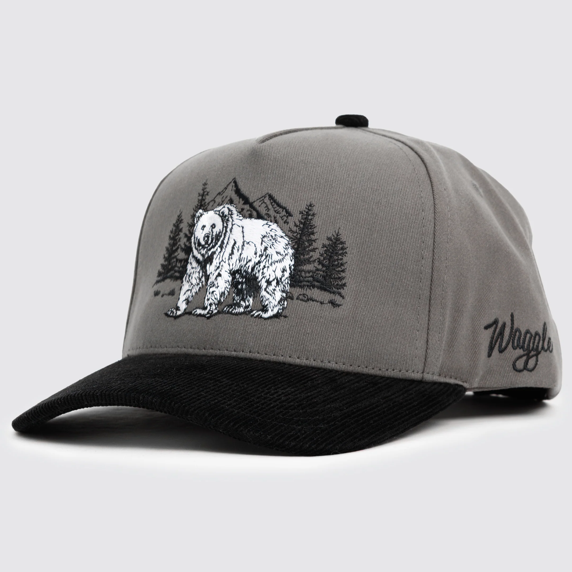Waggle Grizz Corduroy Brim Hat, angled front view, grey with black corduroy brim, bear embroidery and Waggle script text
