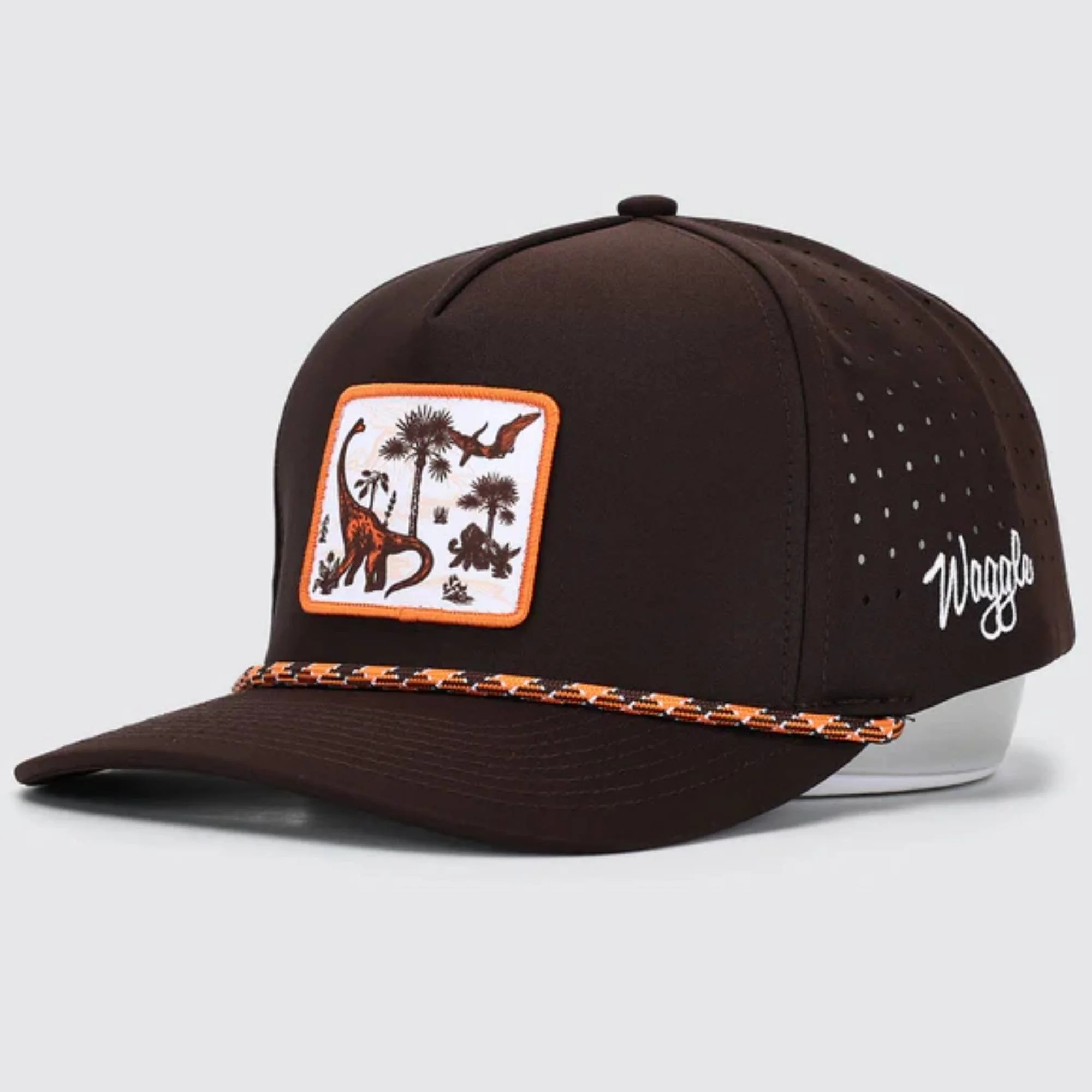 Waggle Land Before Golf hat, angled front view showing dinosaur patch detail