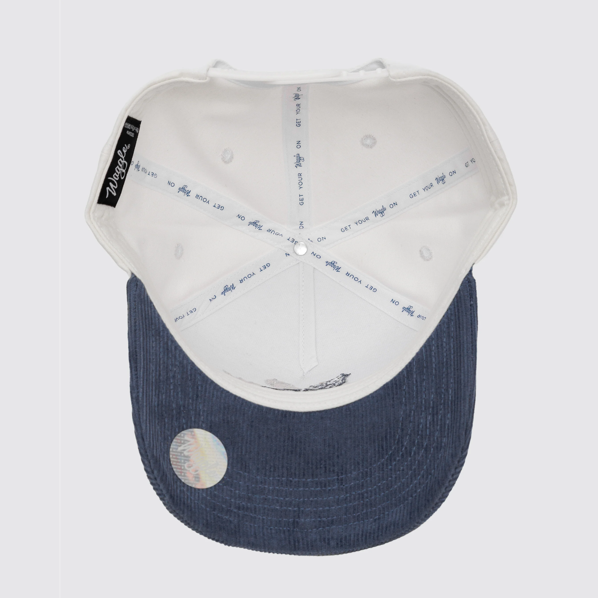 Waggle Alpha Corduroy Brim hat, underside view showing corduroy brim and Waggle woven label