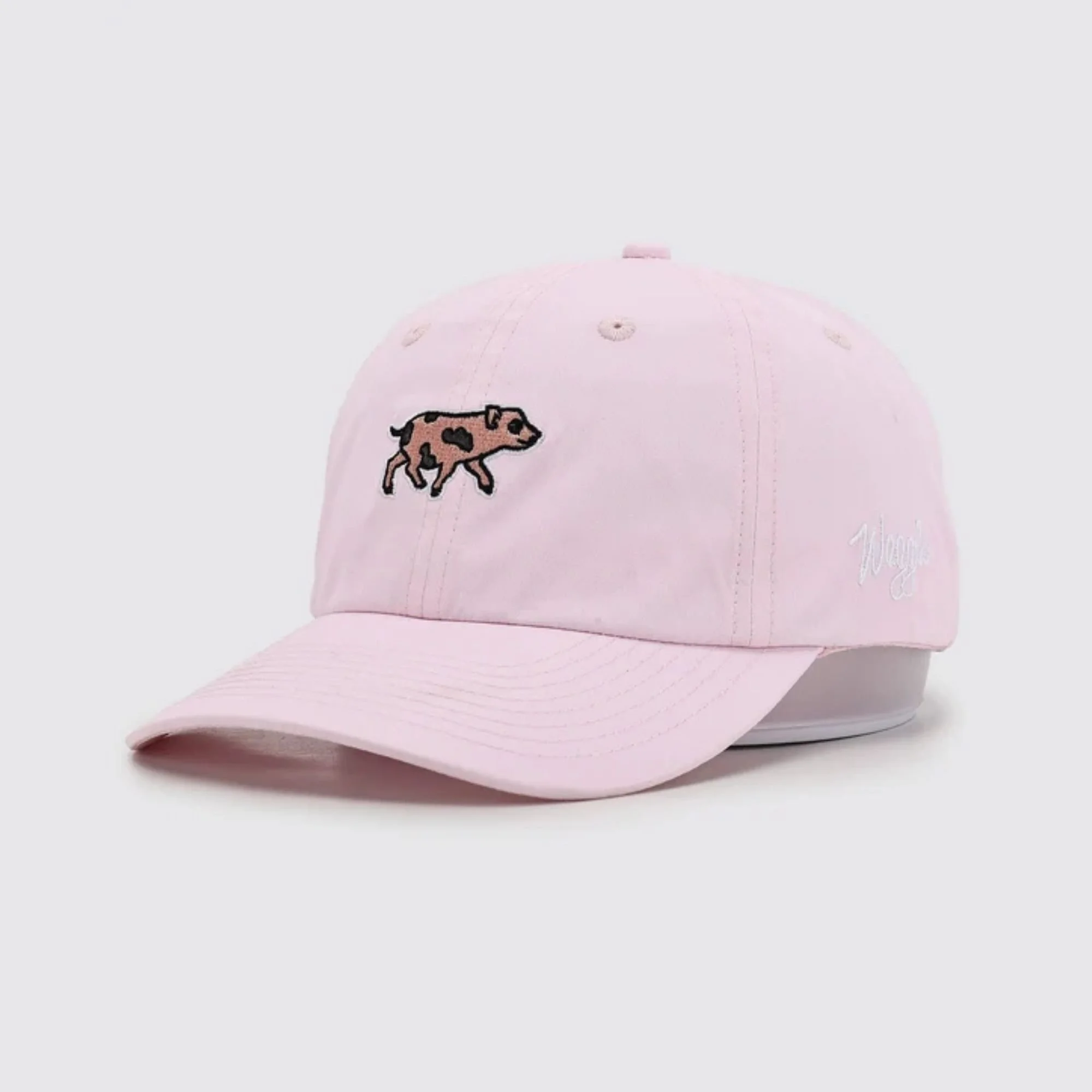 Waggle Babe Flight hat, angled front view, pink, showing pig embroidery detail