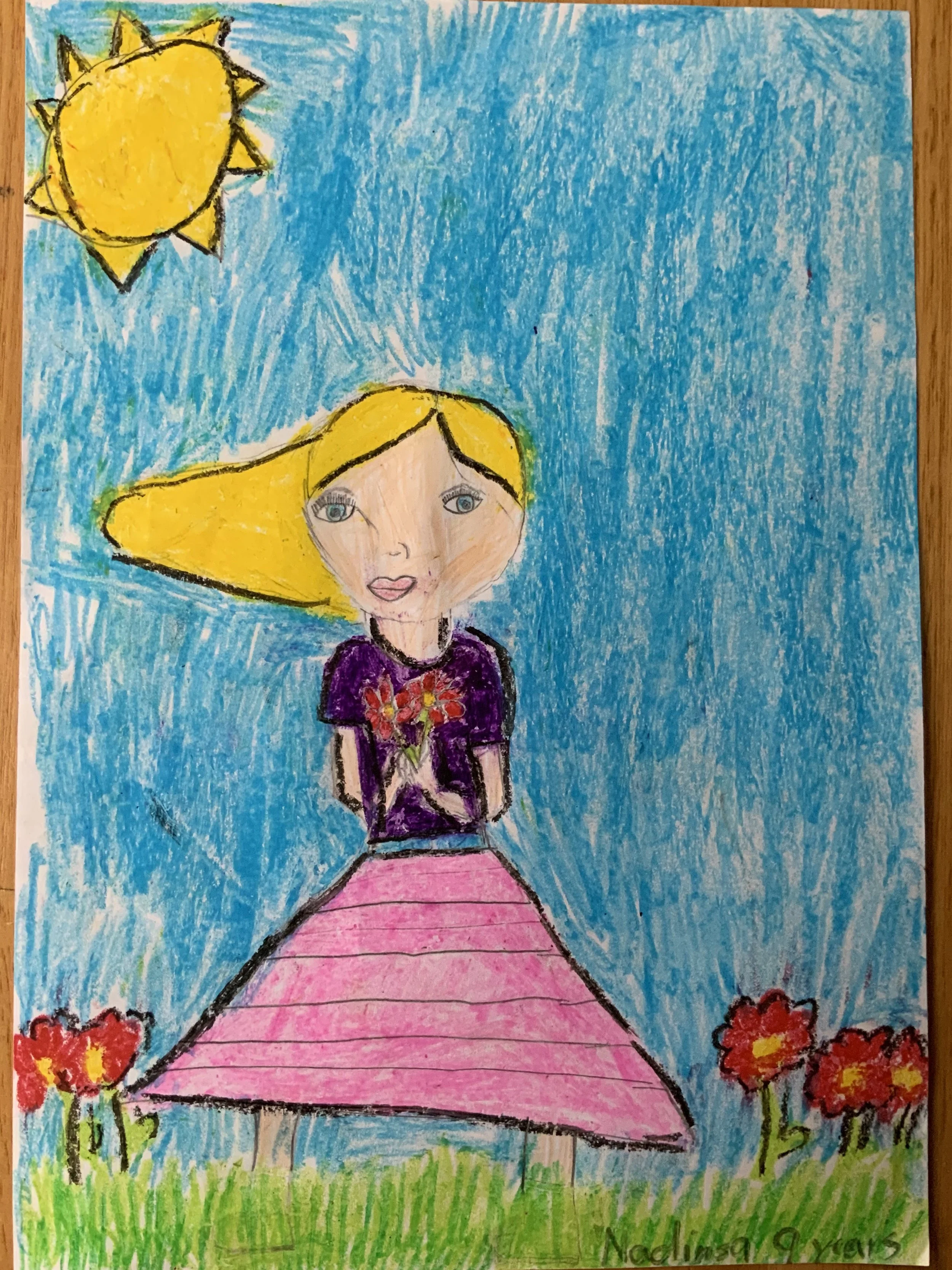 A girl in the flower garden by Nadinsa aged 9.jpeg