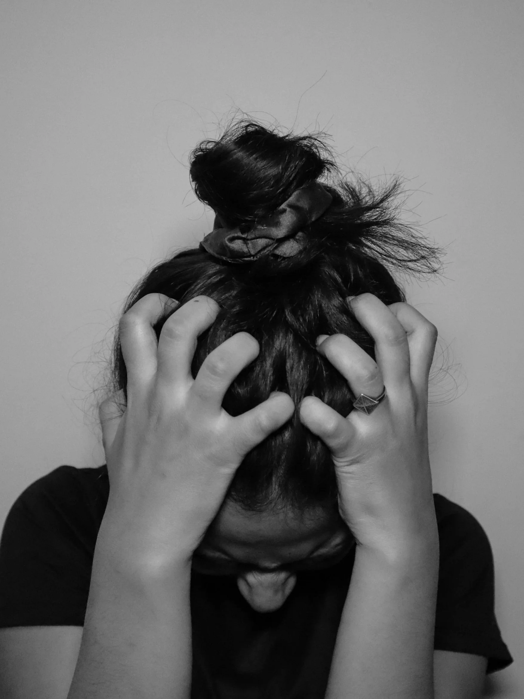 Woman experiencing anxiety and emotional overwhelm.