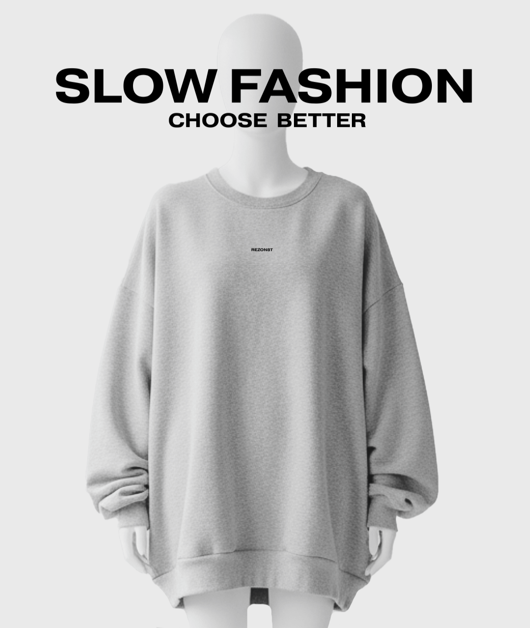 A mannequin wearing a oversized gray sweatshirt. The text "SLOW FASHION CHOOSE BETTER" is overlaid at the top of the image, with a small logo or brand name "REZON8T" on the chest area of the sweatshirt.