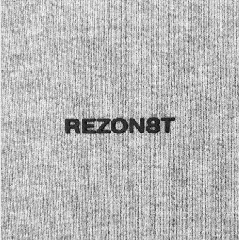 Close-up of REZON8T logo on grey premium cotton fabric.