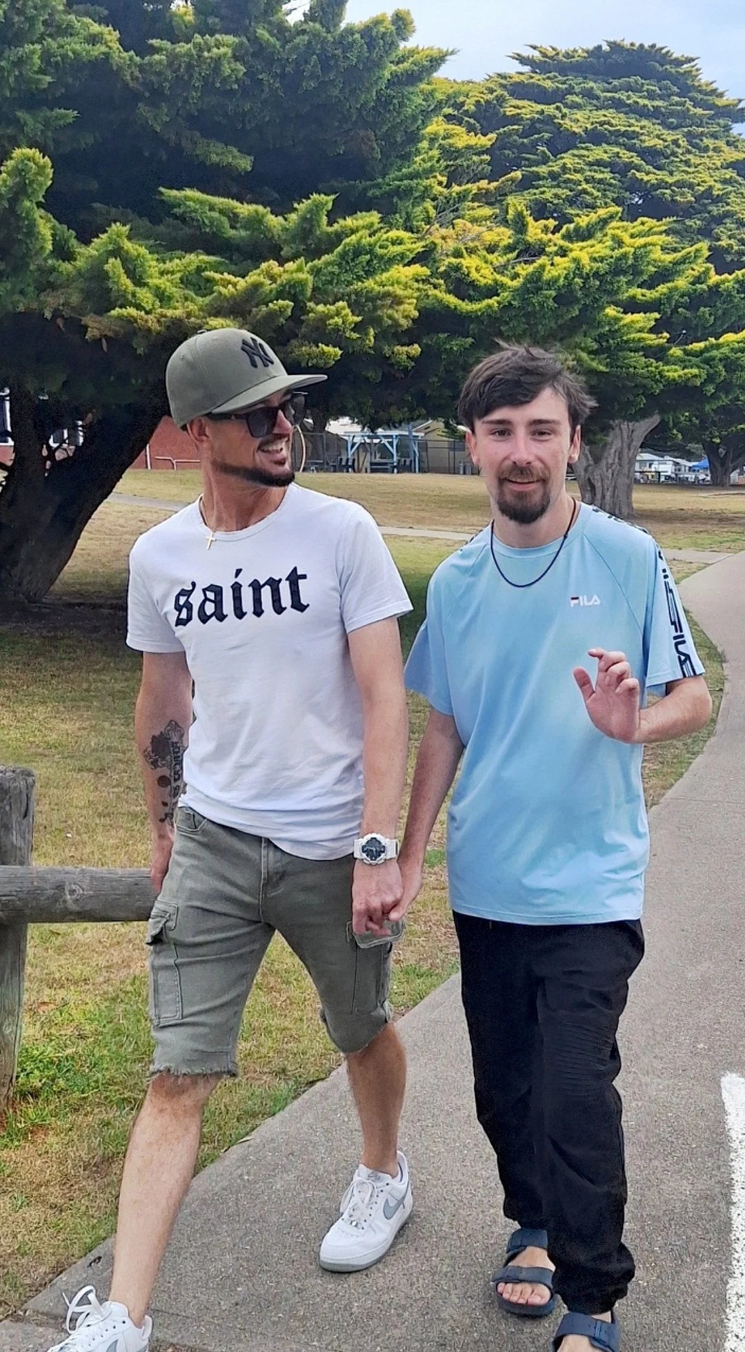 Two men walking along a path