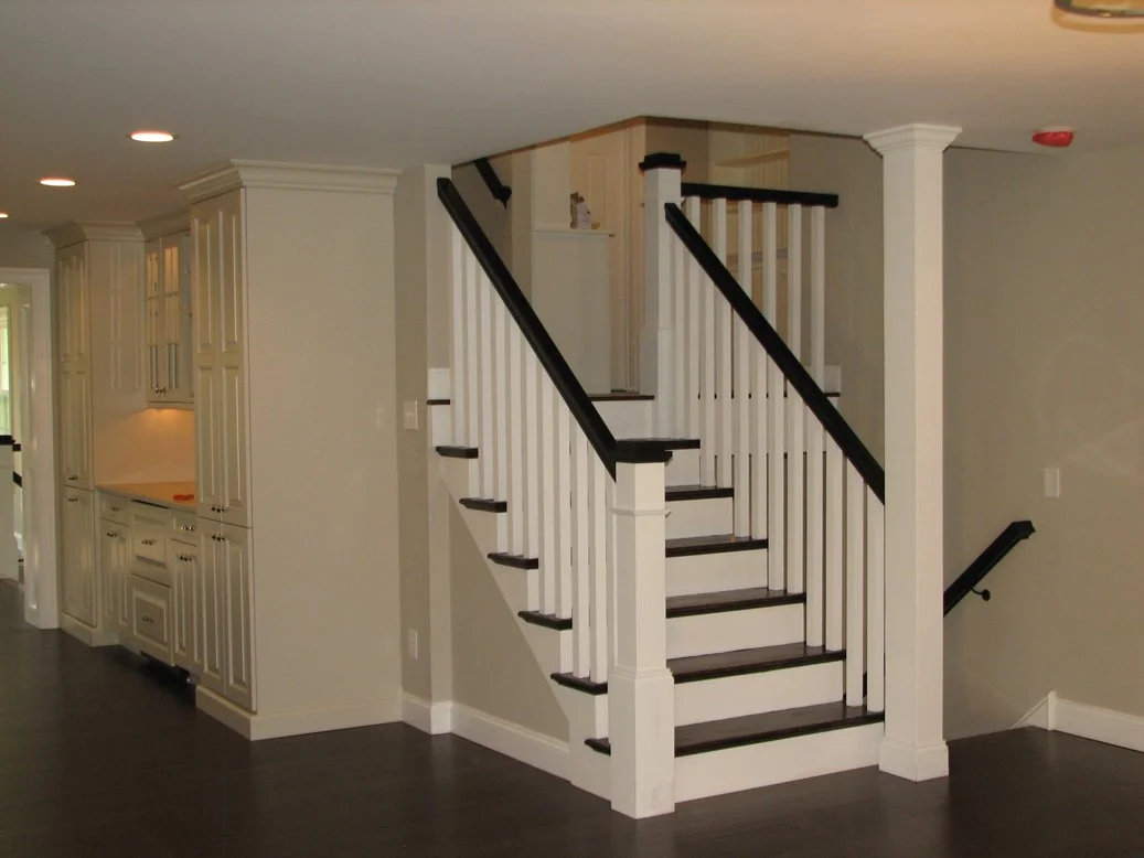 Interior stair with black railings and treads