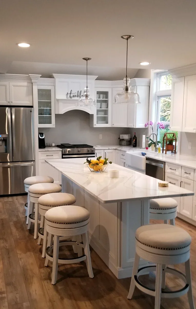 Kitchen with island and white cabinets