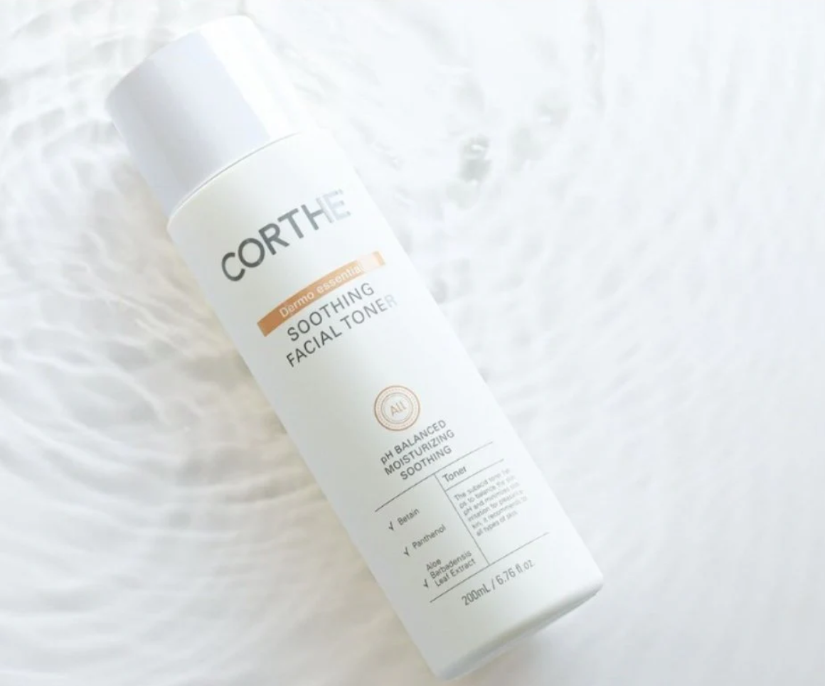 Corthe Dermo Essential Soothing Facial Toner bottle laying in water, highlighting hydration and freshness | Louloùdi Esthetics