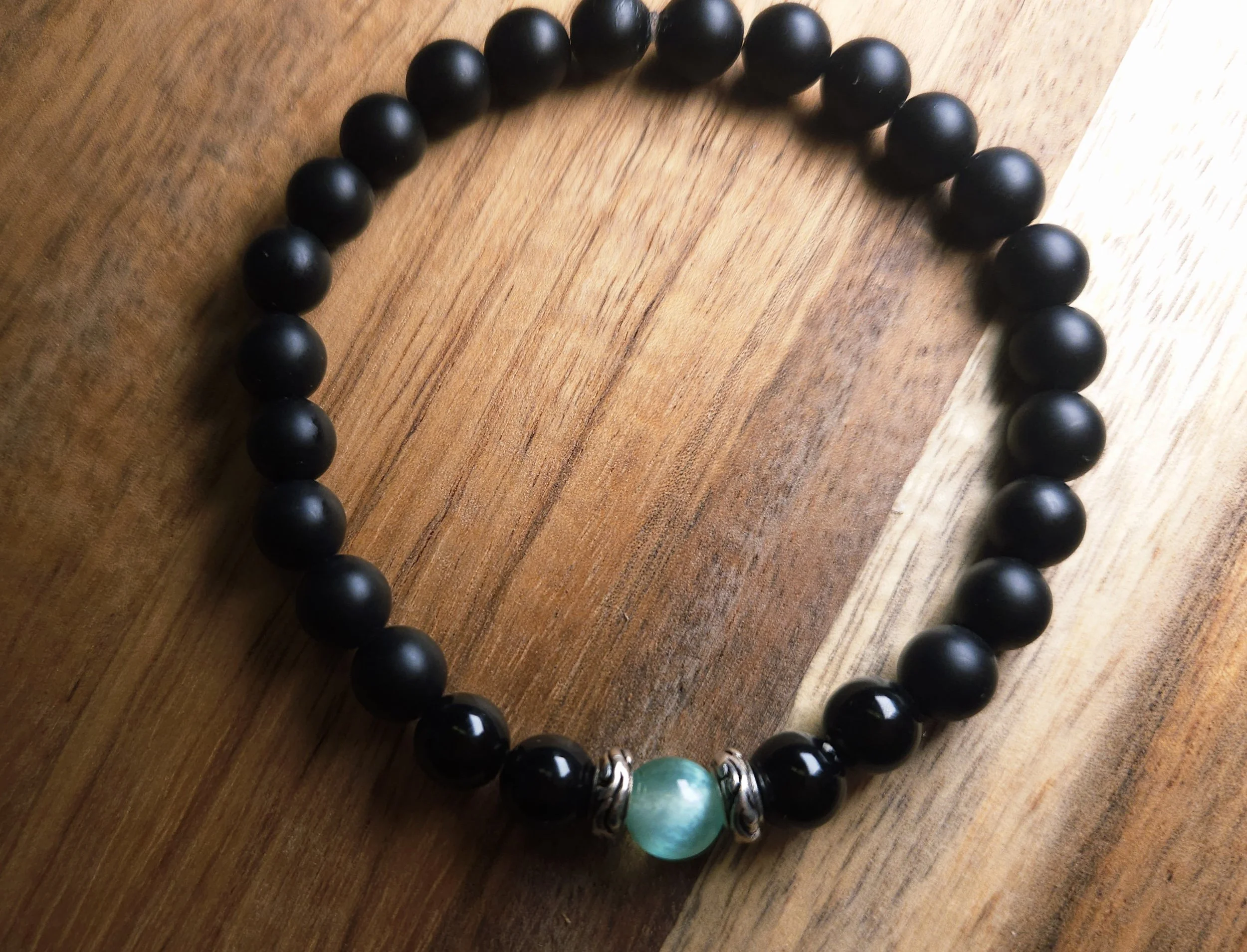 beaded black and selenite green sea colored chakra bracelet