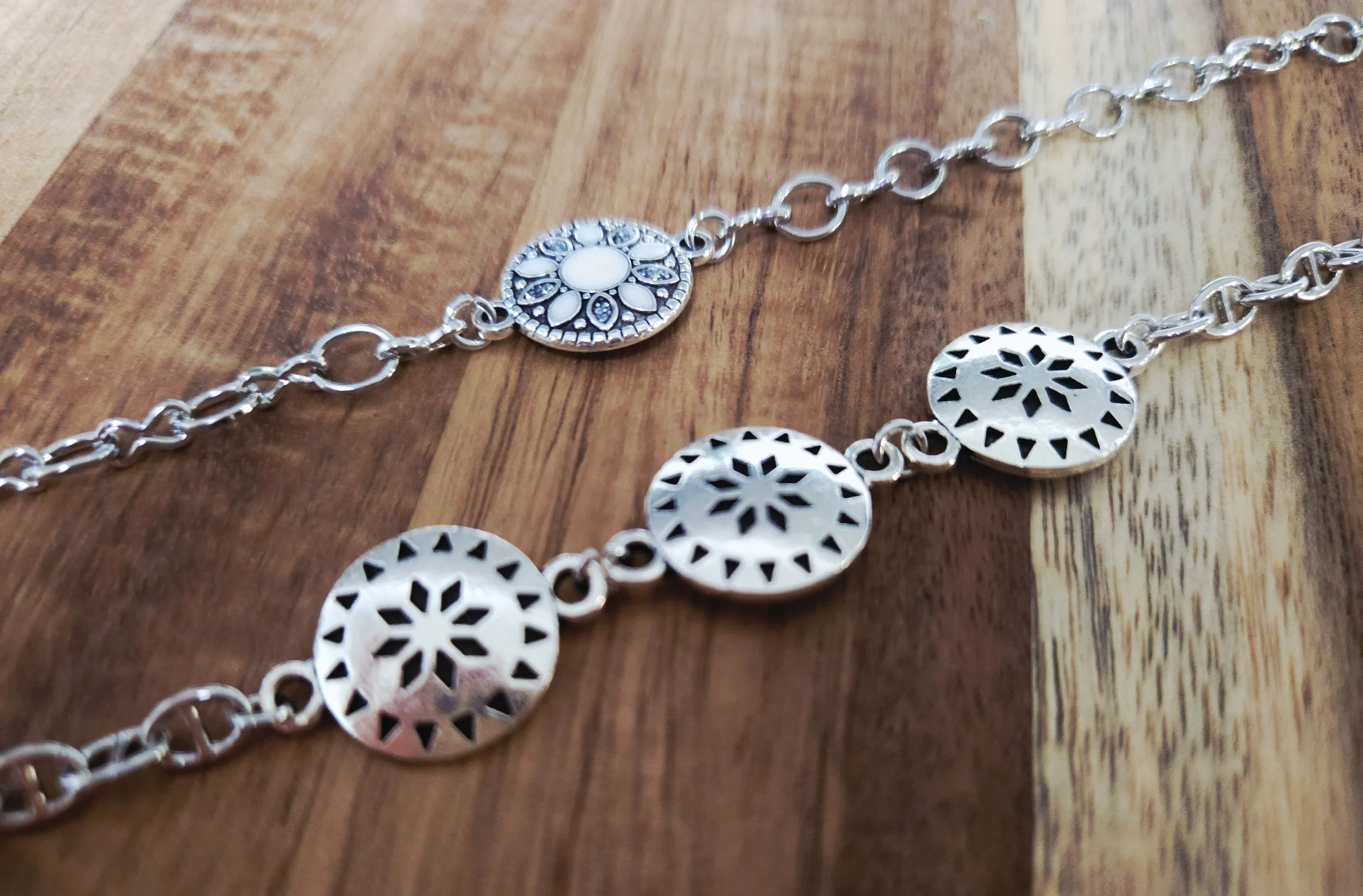 two stacking bracelets lined up together with conchos and western style