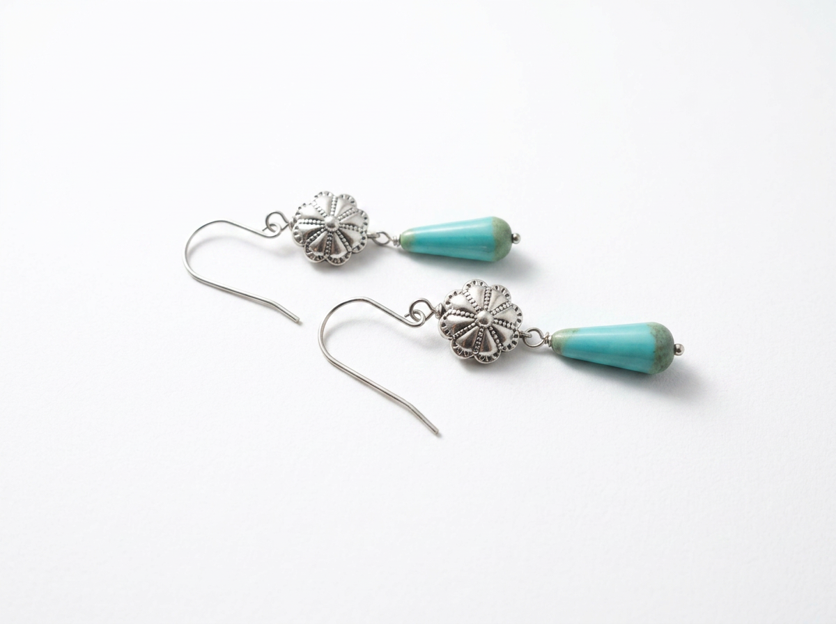 Turquoise western earrings with silver floral concho detail
