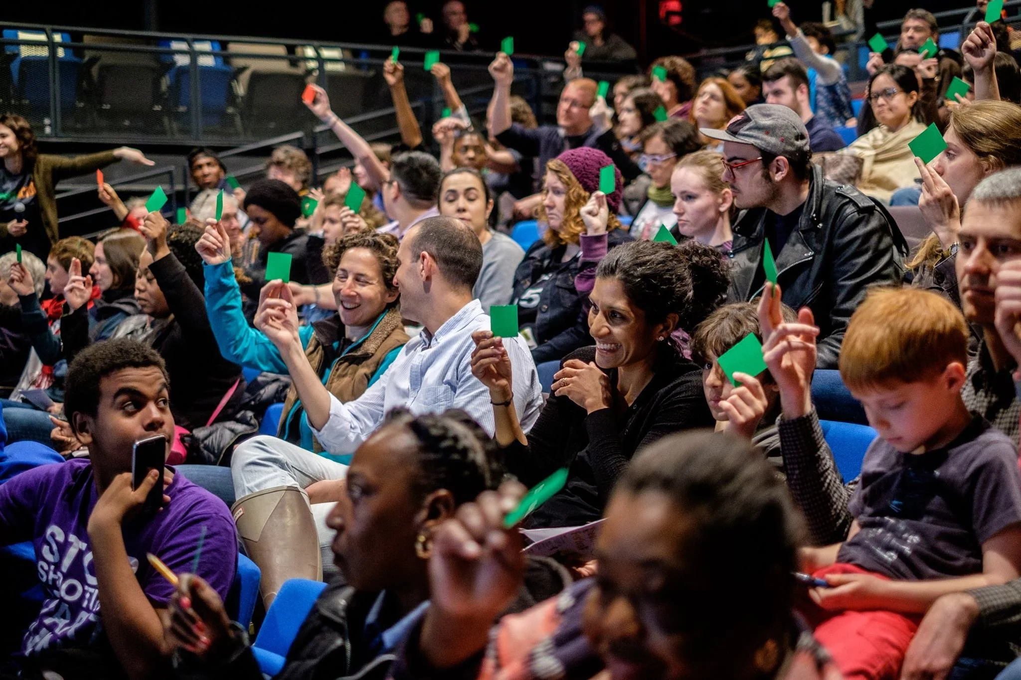 An audience votes in a Legislative Theatre process in New York City