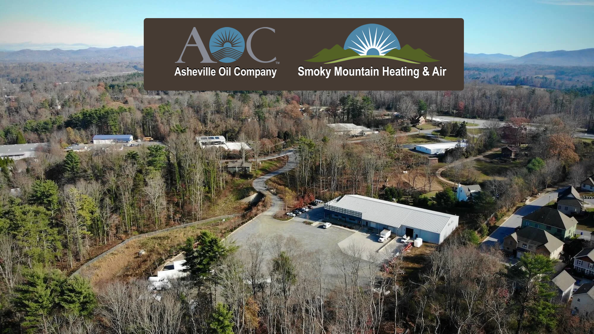 An aerial view of our warehouse with the Asheville Oil Company and Smoky Mountain Heating & Air logos