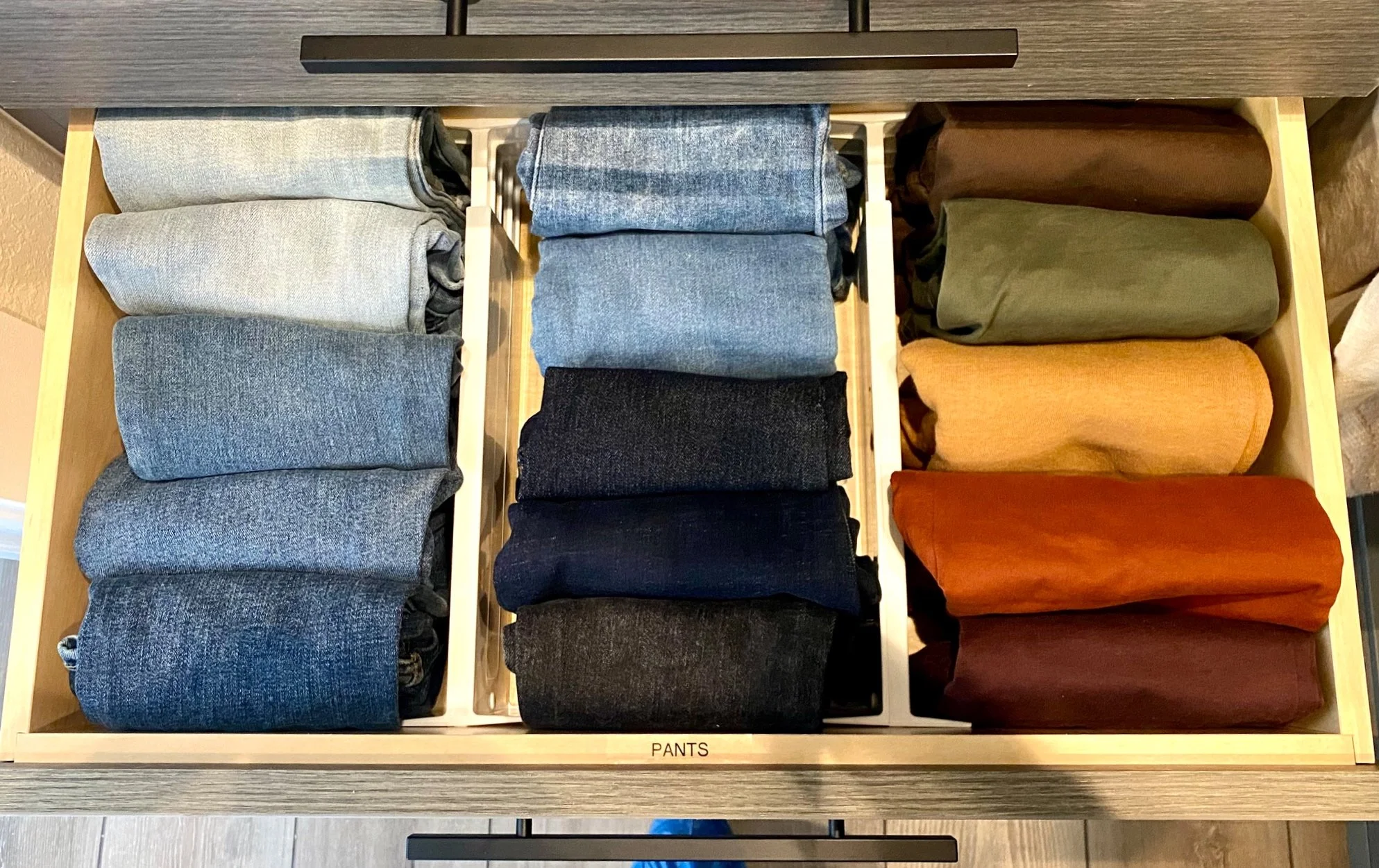 Drawer organization for folded jeans and clothing by professional organizer in Austin TX