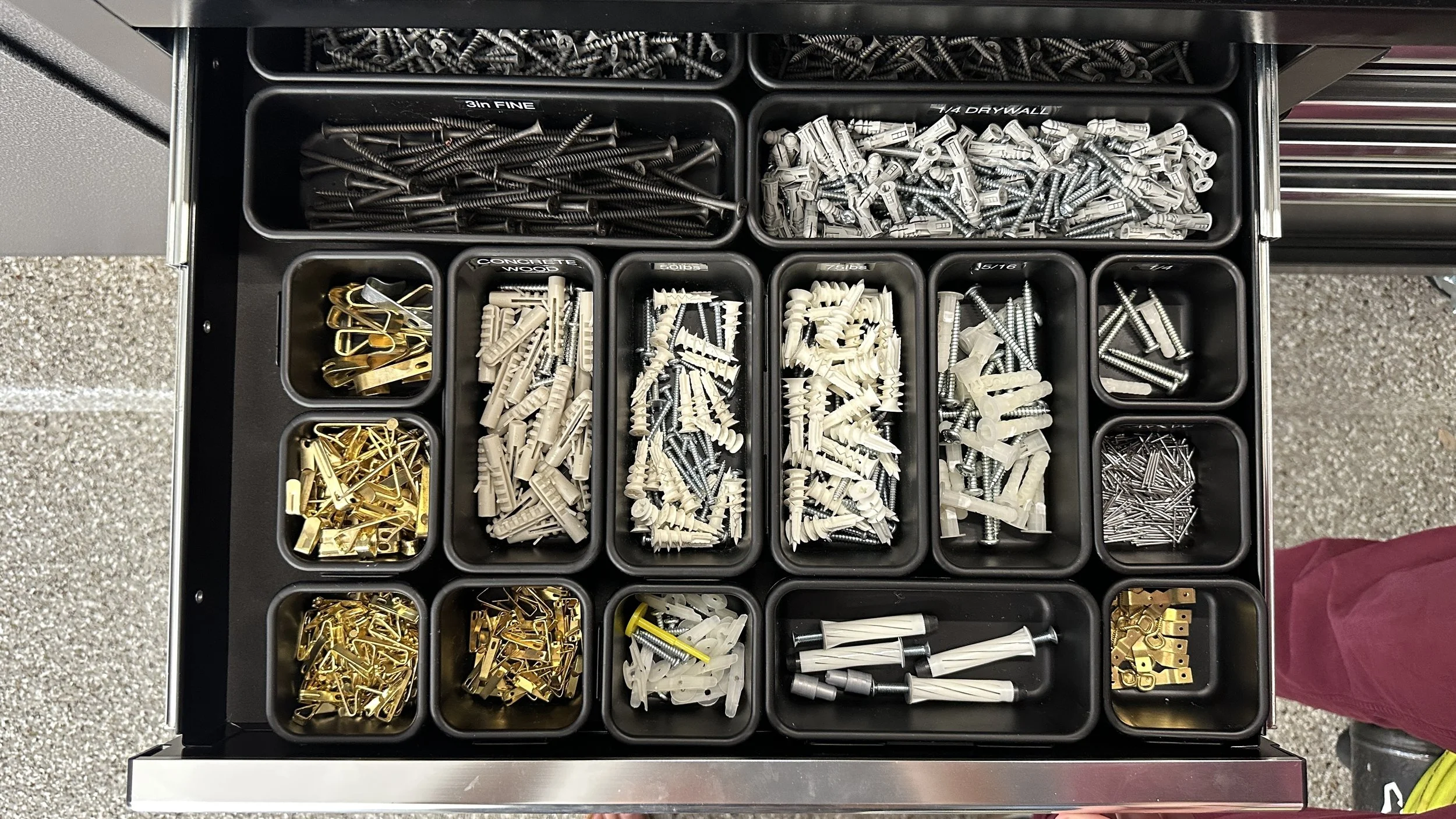 Garage hardware organization with labeled bins by professional organizer in Austin TX