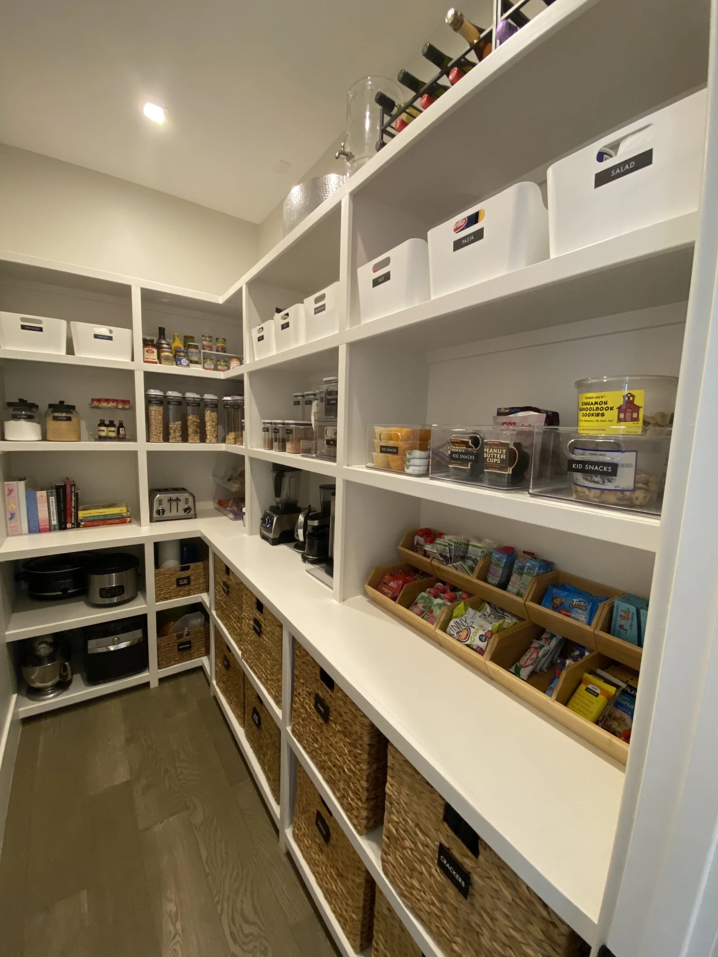 Walk-in pantry organization with custom shelving by Austin TX professional organizer