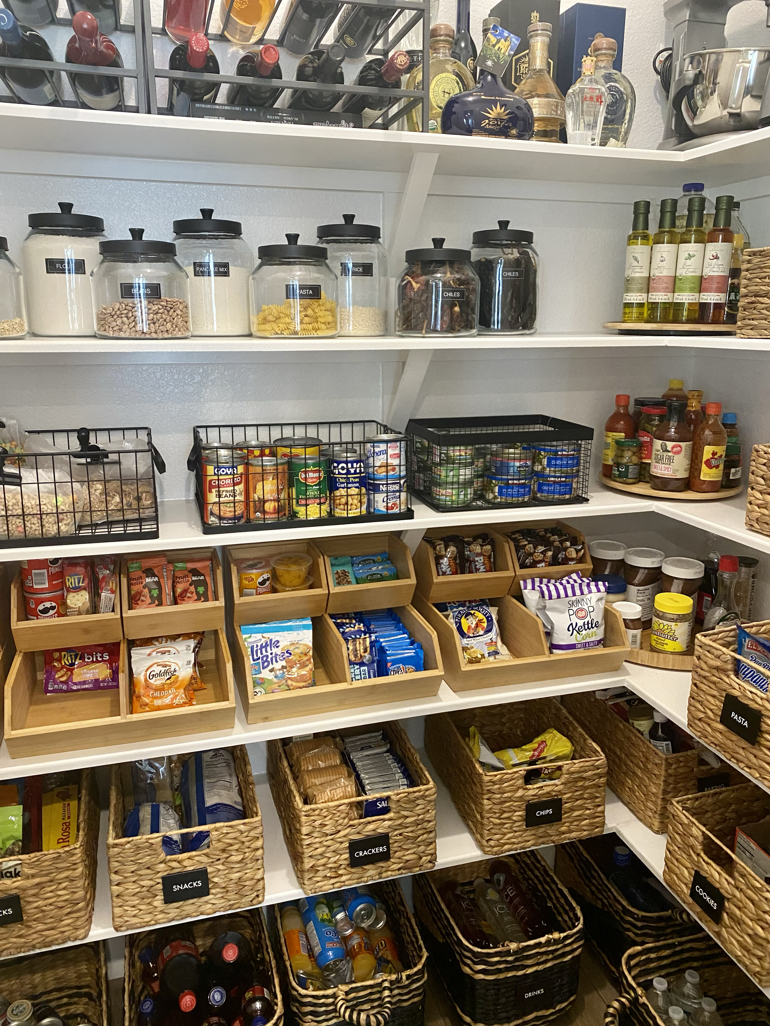 Luxury pantry organization system with labeled containers and baskets in Austin Texas home