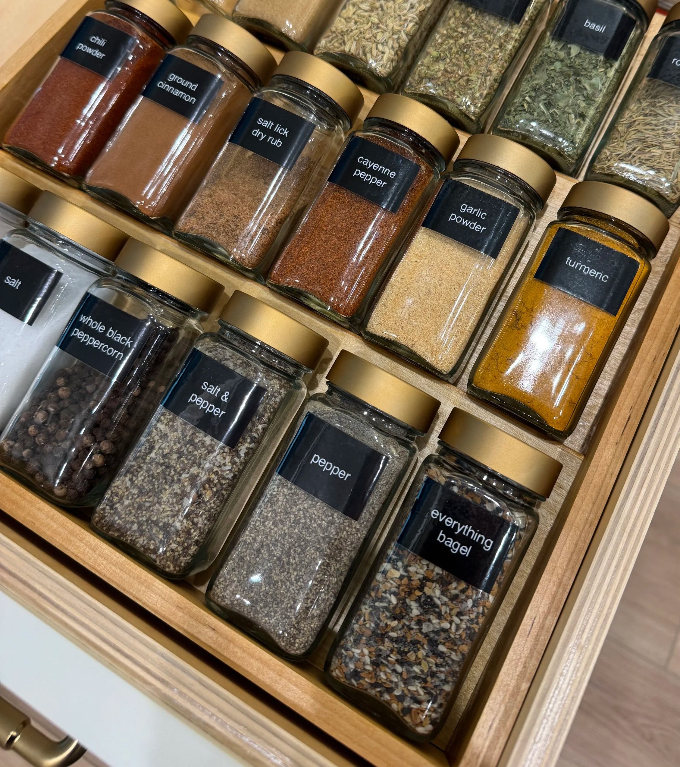 Custom spice drawer and pantry organization by professional home organizer in Austin TX