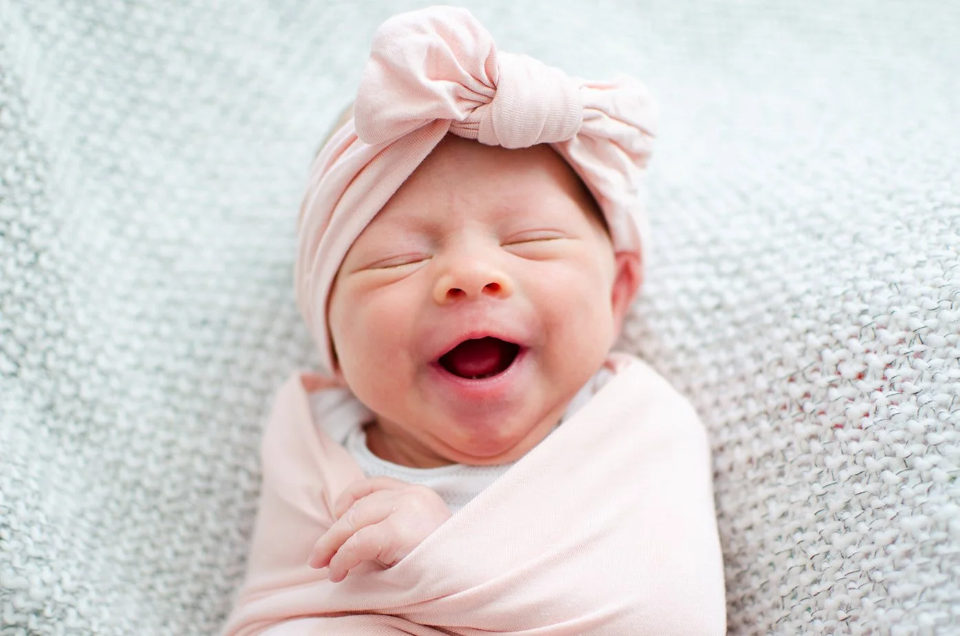 newborn-portrait-photography-pink-smile.jpg