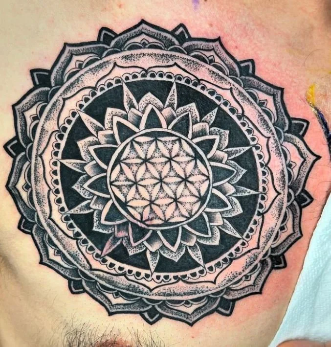 Close-up photograph of geometric tattoo on chest