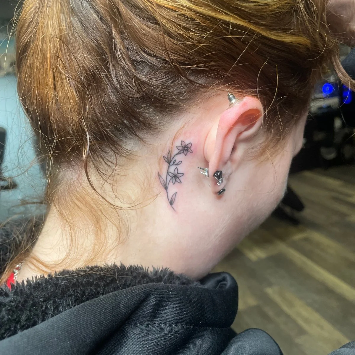 ear flower tattoo.jpg