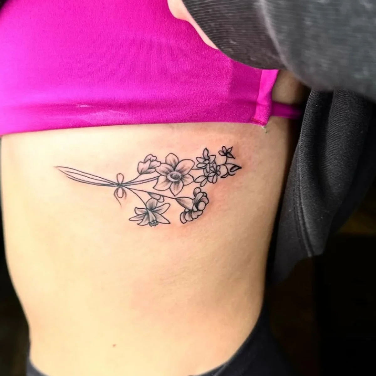 flower tattoo in ribs.jpg