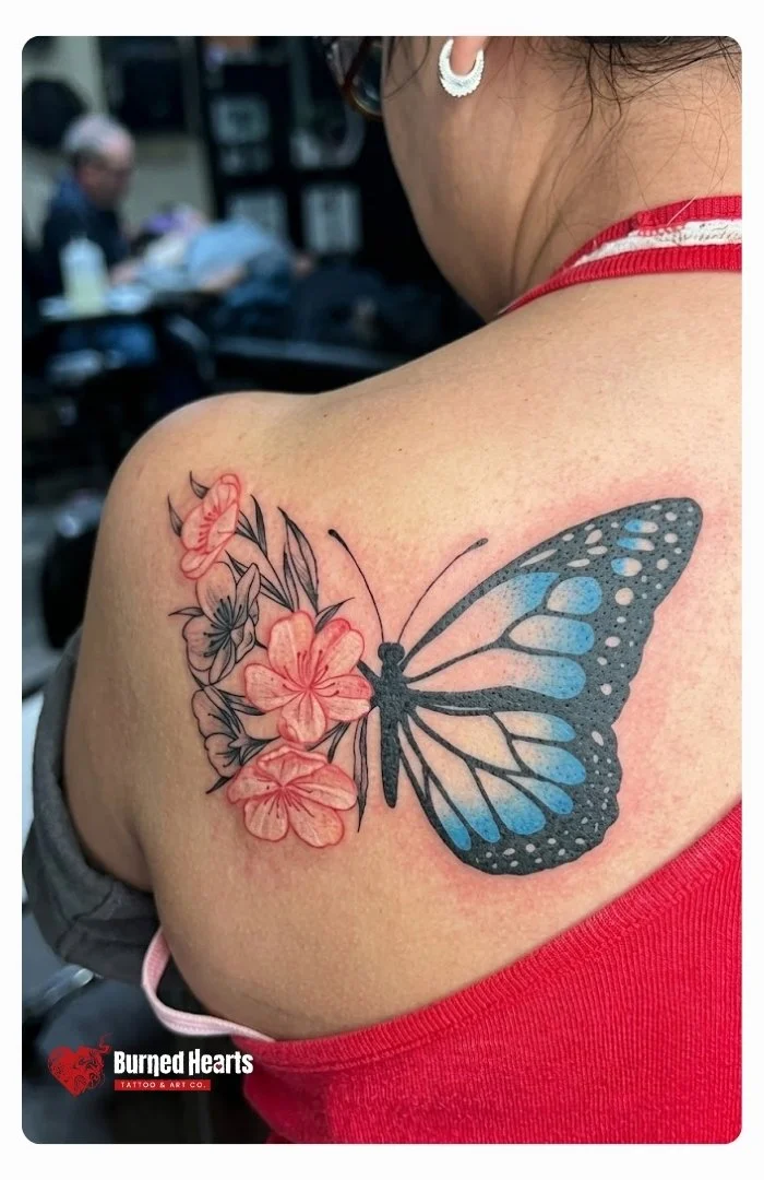 Blue Butterfly tattoo with cherry blossoms