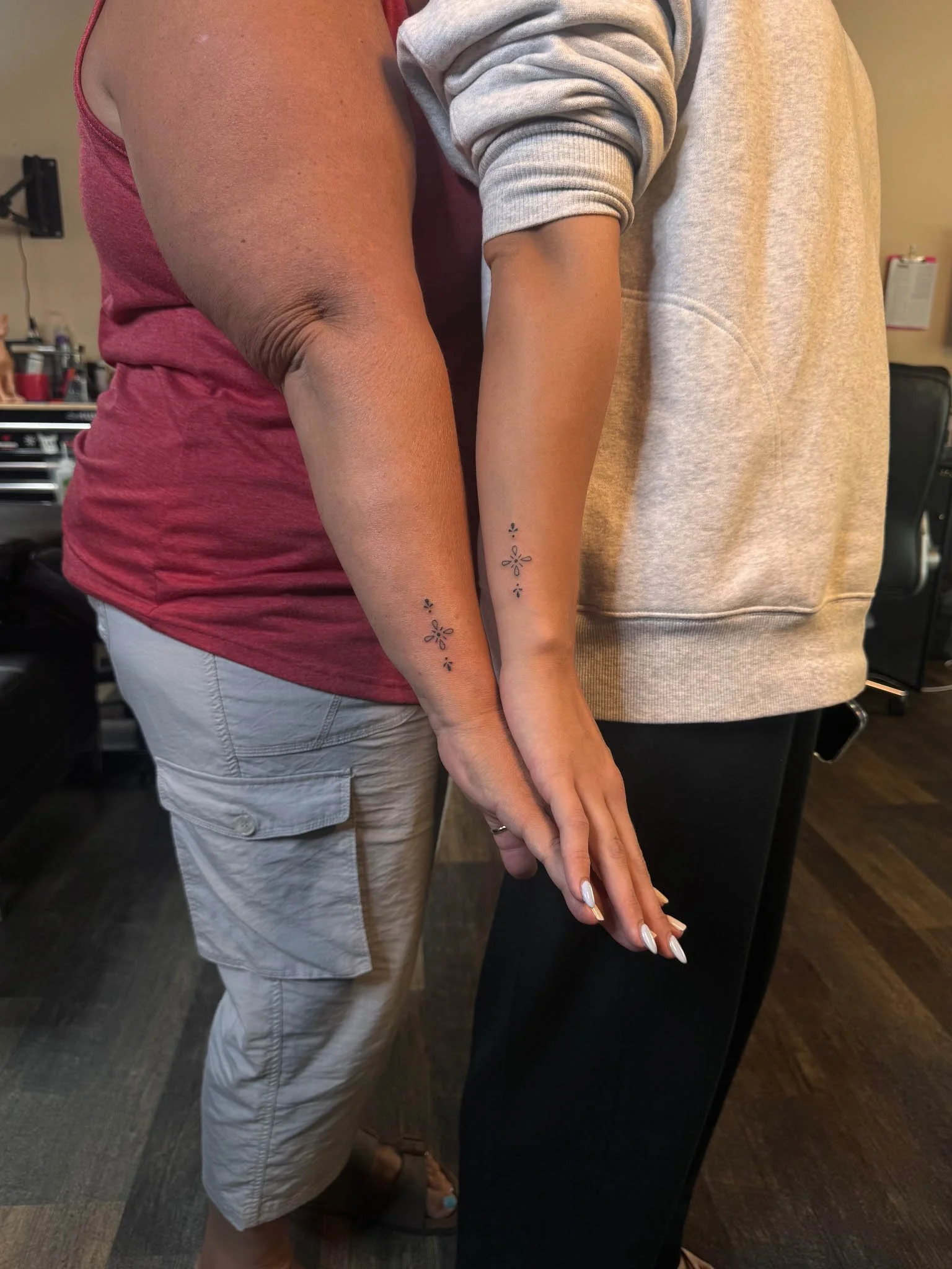 Matching minimalist tattoo