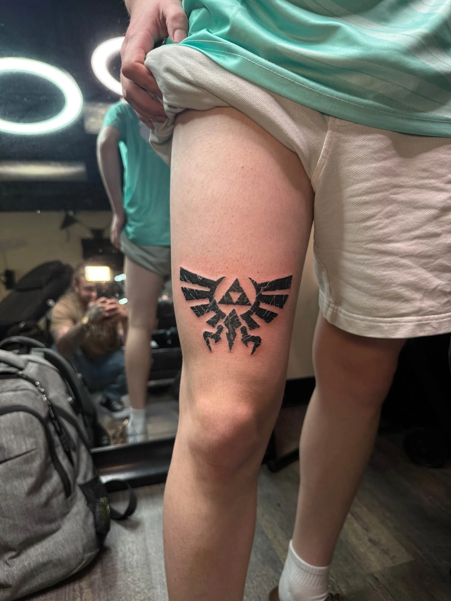 Fresh leg tattoo on a person standing