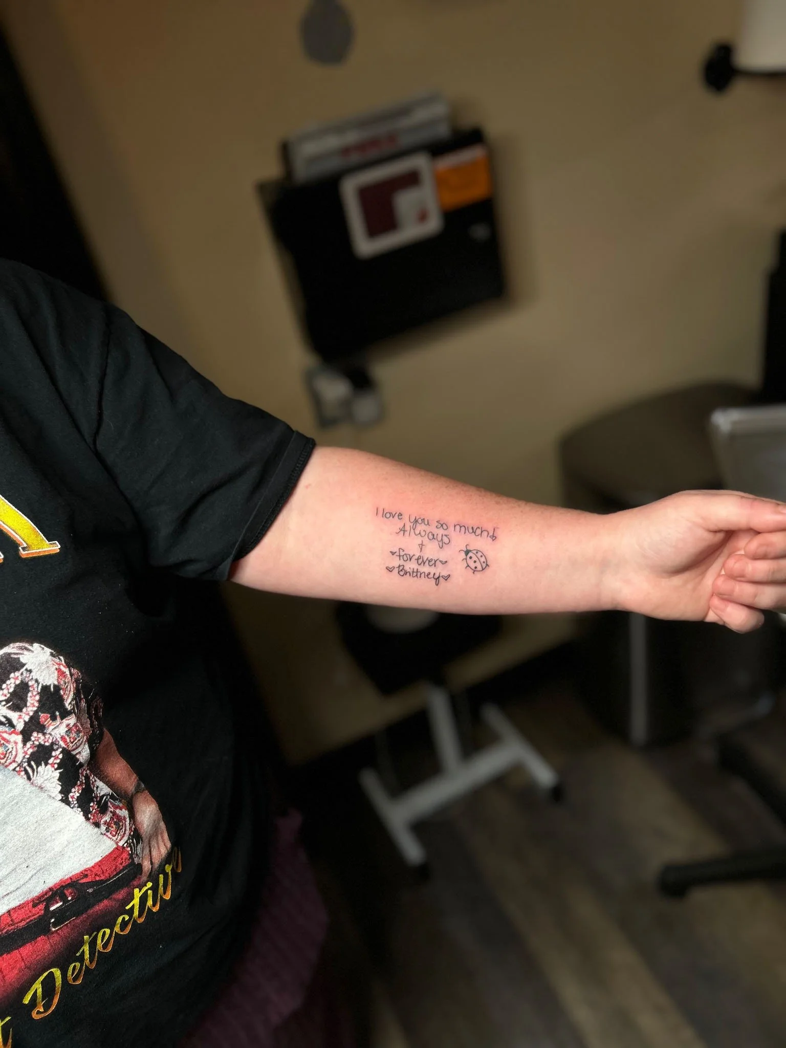 Inner forearm handwriting tattoo